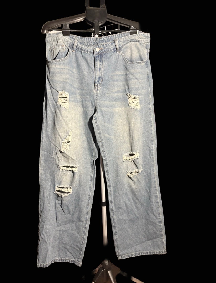 Distressed light blue jeans￼